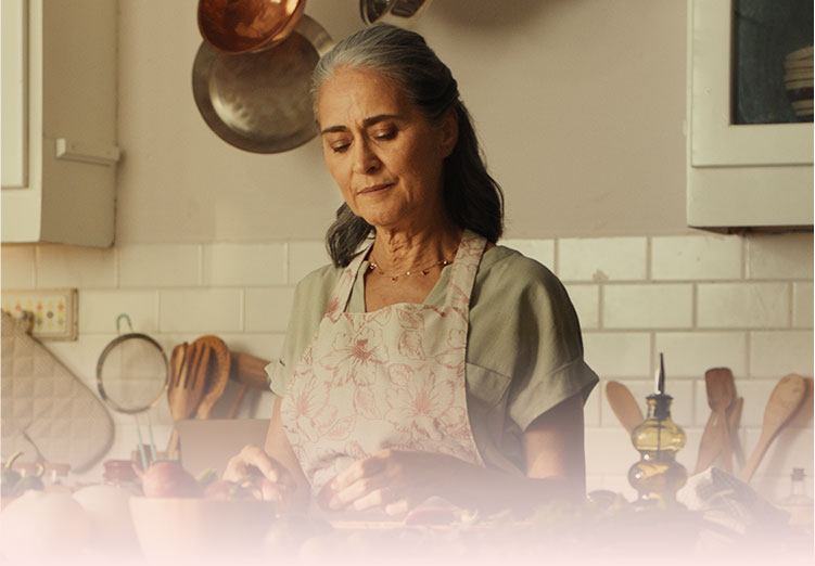 Woman preparing a meal in her kitchen